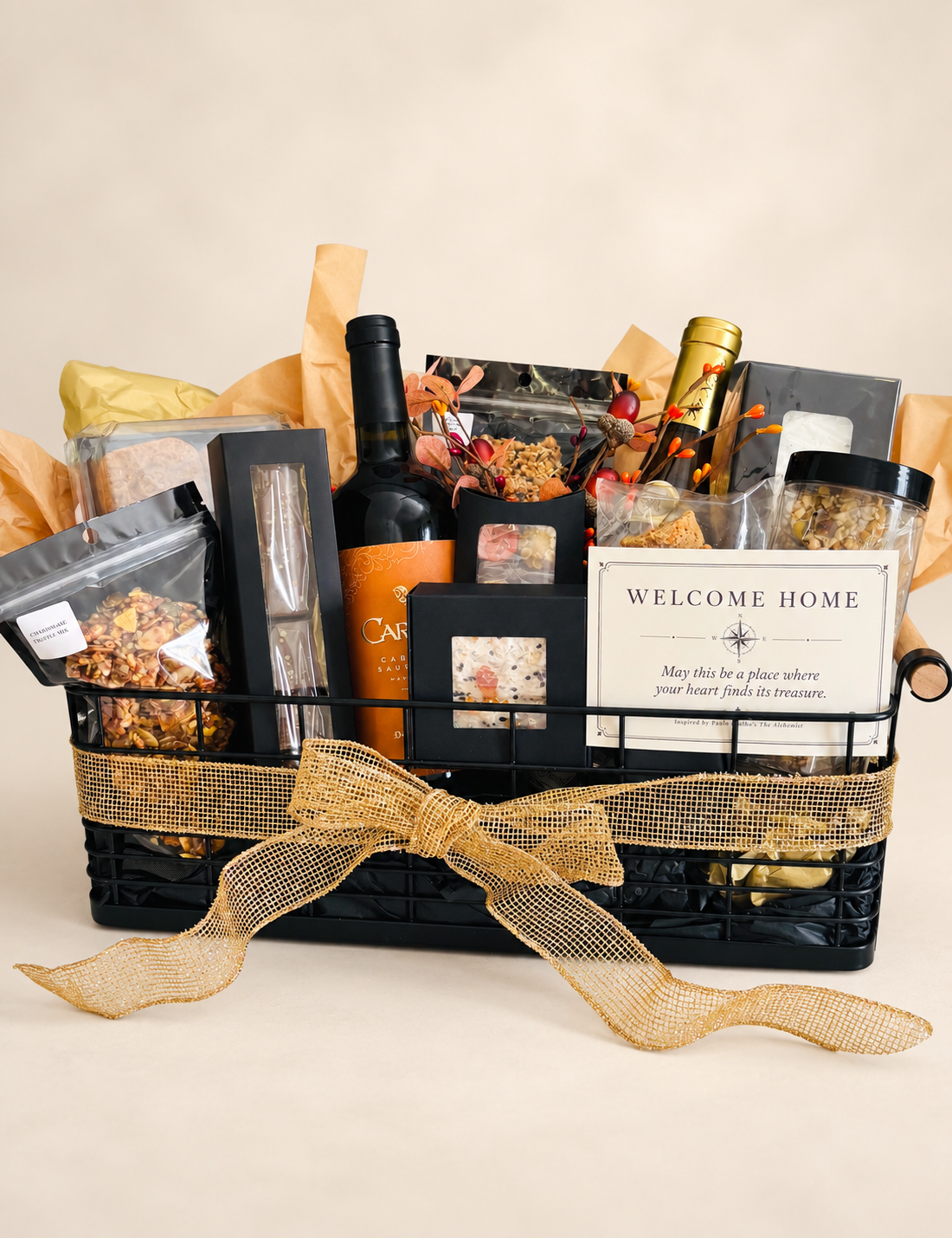 Curated Sweet Alchemy gift basket with wine, wrapped confections and dried floral